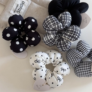 Five-pack set of black and white patterned floral scrunchies with polka dots and checks