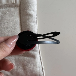 Detailed back view of metal BB hair clip with red round velvet embroidery accessory