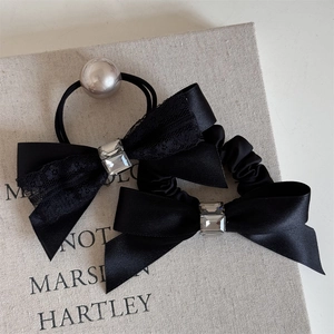 Elegant black satin bow hair ties with sparkling crystal gems and pearl accents