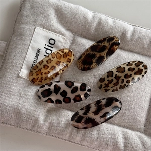 5-piece set of stylish leopard print oval hair clips in various chic resin patterns