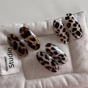 Set of six retro leopard print oval hair clips in resin with various animal patterns