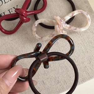 Premium acetate resin knotted bow hair ties in red and marble patterns for women