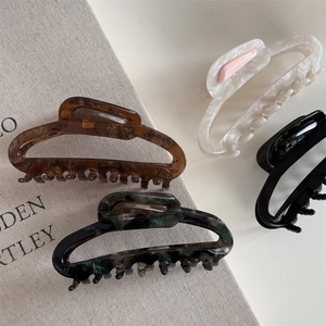 Detailed set of four hollow acetic acid hair claws with vintage marble and tortoiseshell patterns