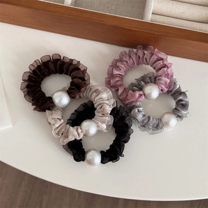 Elegant velvet pearl scrunchies set in neutral colors for high ponytail hairstyles