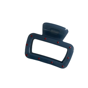 Minimalist misty blue hair claw clip with red polka dots in a glossy rectangular design