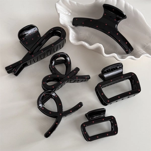 French style black hair claw set with red polka dots in various elegant shapes