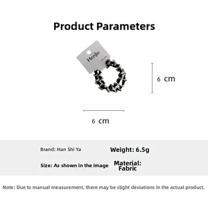 Detailed view of elastic fabric hair tie with black and white plaid pattern and 6cm size label