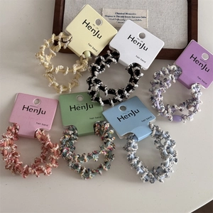 Close-up of spiral knitted elastic hair bands in assorted soft pastel colors