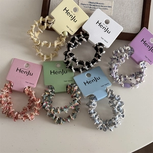 Spiral woven high elasticity hair bands in various colors on aesthetic background
