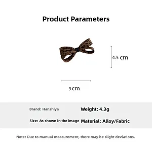 Dettaglio della clip per capelli a fiocco leopardato da 9 cm in lega e tessuto