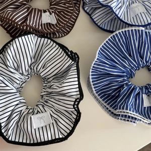 Set of four blue and brown striped scrunchies with elegant silver bow labels