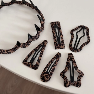 Leopard print hair accessory set with fabric headband and five diverse stylish BB clips