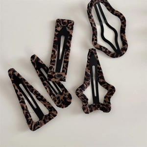 4-piece leopard print fabric hair clip set featuring various geometric shapes for women