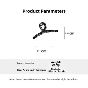Detail view of large black and white twill fabric wrapped hair claw clip with dimensions