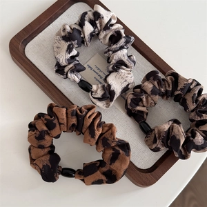 Vintage leopard print scrunchie set in cotton linen with elegant pearl accents for women