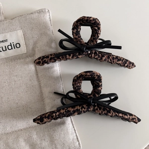 Chic leopard print hair claws with black leather bows for elegant winter updos set of 2