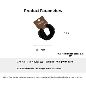 Detail view of 6.5cm black lace hair tie with dimensions on a product display card