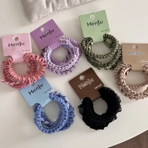 Set of 4 high-elasticity hair scrunchies on color-matched cards with knit texture