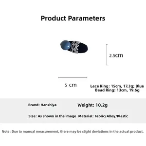 Detail showing dimensions and material of the navy blue lace bow hairpin with blue bead