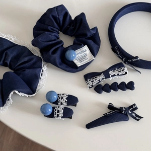 Navy blue lace bow hair clip and headband set with white floral embroidery and bead accents