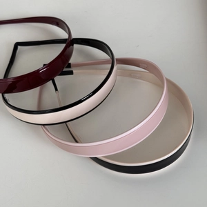 Set of minimalist glossy hairbands in burgundy, beige, black, and pink colors