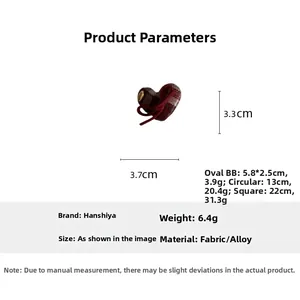 Detailed view of red plaid heart-shaped hair clip with dimensions 3.3cm by 3.7cm