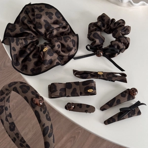 7-piece vintage leopard print hair accessories set including bows and headbands