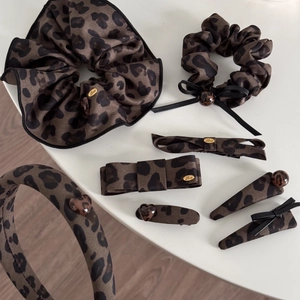 Vintage leopard print bow hair clip set with brown animal pattern and gold Love charm