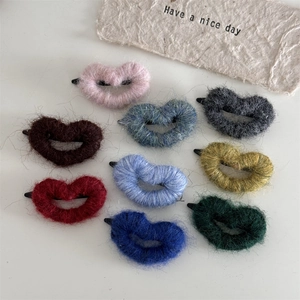 Set of nine colorful heart-shaped plush hair clips in soft mohair fabric for women