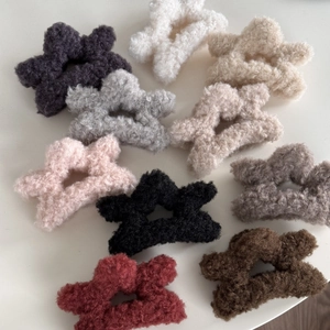 Star-shaped plush faux fur hair claw clips in various colors for elegant autumn winter styles