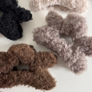 Plush faux fur scrunchie set in black, cream, pink, and brown for elegant hair styling