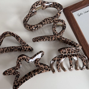 Set of five elegant leopard print hair claws in various geometric resin shapes