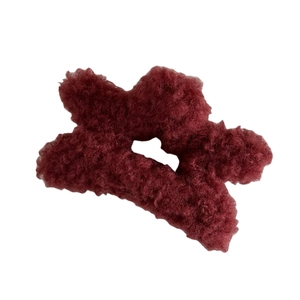 Plush lamb wool star-shaped claw clip in deep wine red color for elegant hair styling