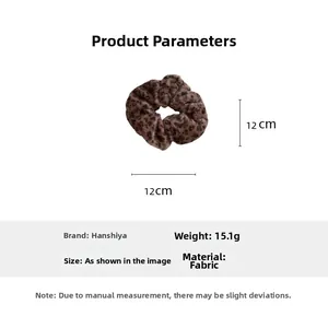 Detail view of plush brown leopard print scrunchie with 12cm diameter and soft texture