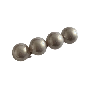 Barrette élégante en or champagne avec quatre grandes perles brillantes au design linéaire