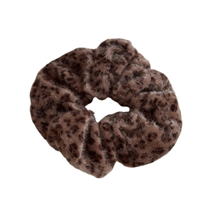 Brown leopard print plush scrunchie with soft faux fur texture for winter hairstyling