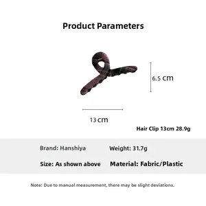Detail view of purple plaid hair claw clip with 13cm x 6.5cm dimensions and 31.7g weight