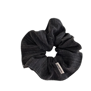 Retro striped scrunchie in dark grey denim with handmade label and contrast stitching