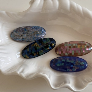 Set of four handmade oval hair clips with glittery shell mosaic checkered patterns