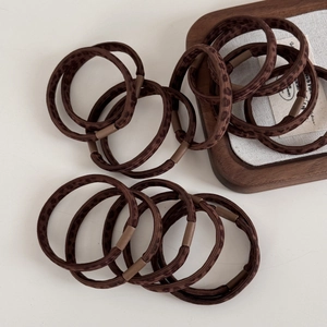 Close-up of leopard print elastic hair ties set with retro brown pattern and matte seals
