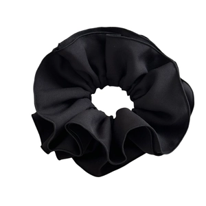 Classic black scrunchie for ponytails featuring premium fabric with soft pleated texture