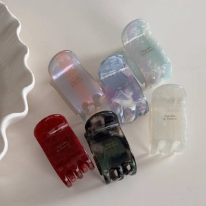 Set of colorful acetate hair claws in various marble textures for thick hair styling