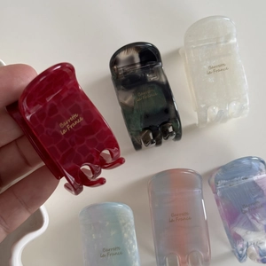 Set of six assorted acetate hair claws with Barrette la France logo in diverse colors