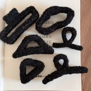 Elegant black fuzzy hair clips with glitter threads in various geometric shapes