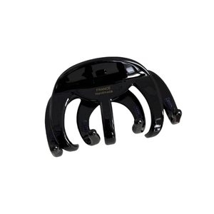 Classic black acetate hair claw clip with large octopus design and glossy finish