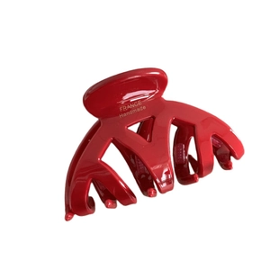 Pince à cheveux rouge brillant en acétate avec inscription dorée pour une coiffure élégante