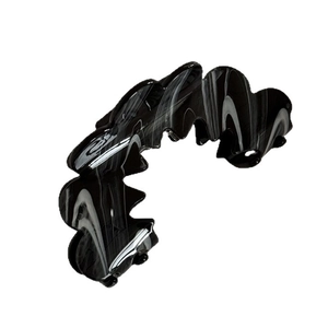 Minimalist French style wavy hair claw with black and white marble resin texture