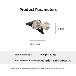 Detailed view of lace bow hair claw clip with measurements 10.6cm long and 5cm high