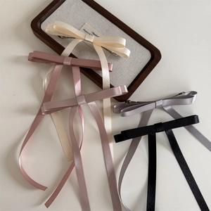 Elegant satin bow hair clips with long streamers in multiple pastel colors