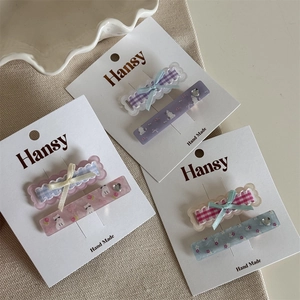 Detailed set of cute cat hair clips with plaid bows and floral patterns in high quality
